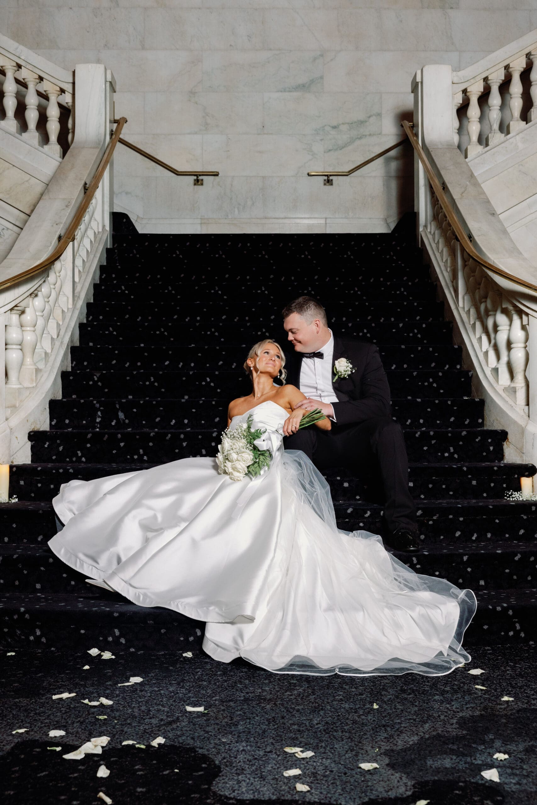 Bride and groom on grand staircase at Renaissance Hotel Pittsburgh during wedding portraits