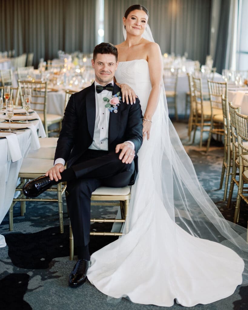Bride and groom seated together during reception portraits at Renaissance Hotel Pittsburgh
