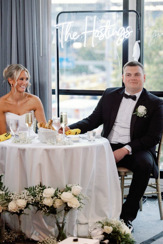 Bride and groom seated at sweetheart table during Renaissance Hotel Pittsburgh reception